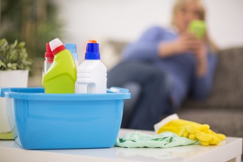 Cleaner using protective equipment during carpet cleaning